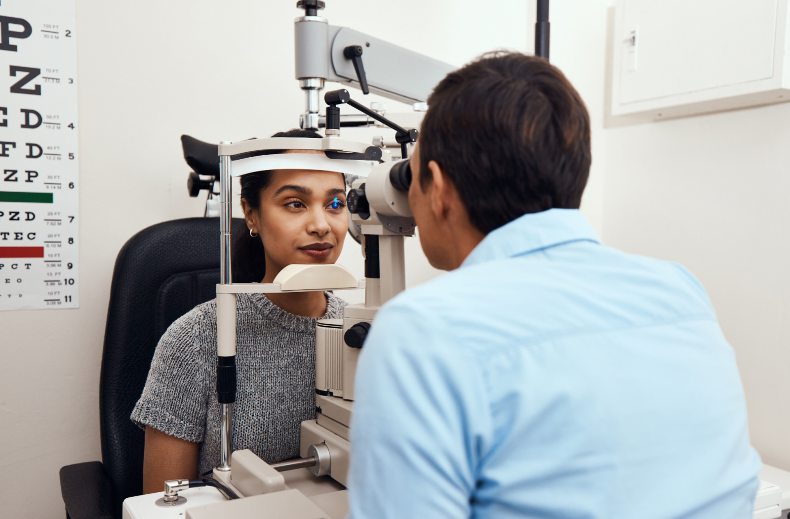 Patient undergoing comprehensive eye examination with slit lamp biomicroscope